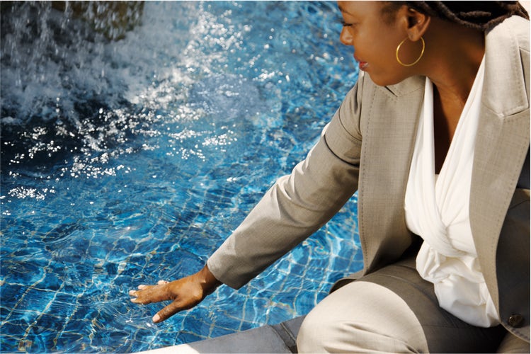 Woman touching water